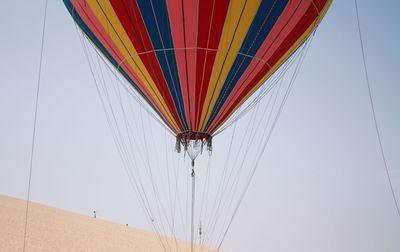 Low angle view of hot air balloon against clear sky