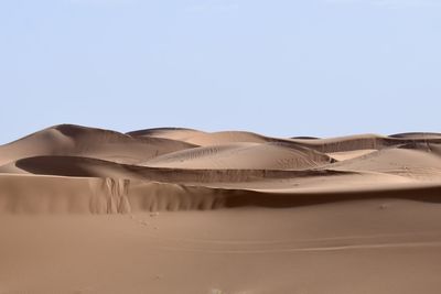 Scenic view of desert against clear sky