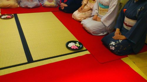 Low section of people standing on carpet