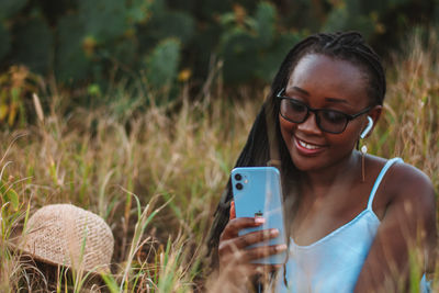 Young woman using mobile phone