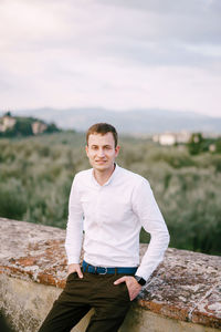 Portrait of man standing outdoors