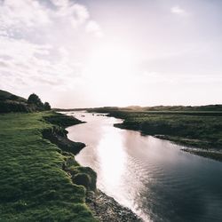 Scenic view of sea against cloudy sky