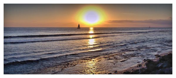 Scenic view of sea against sky during sunset