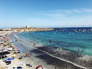 High angle view of people on beach against sky