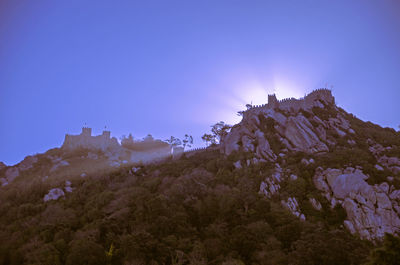 Low angle view of mountains against clear sky