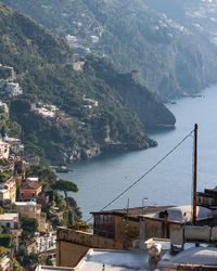 High angle view of buildings by sea