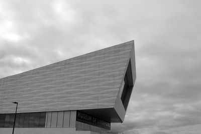 High section of building against cloudy sky