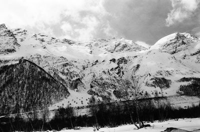 Scenic view of snowcapped mountains against sky