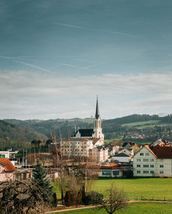 Buildings in city against sky