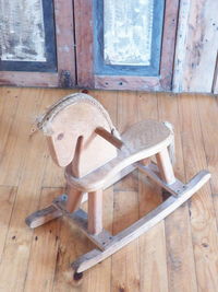 High angle view of wooden chair in house