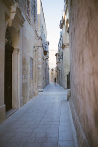 Narrow alley along buildings