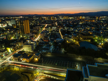 High angle view of illuminated cityscape at night