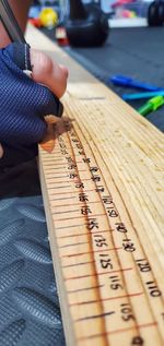 Close-up of hand holding book