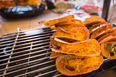 Close-up of tacos on cooling rack