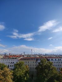 Buildings in city against sky