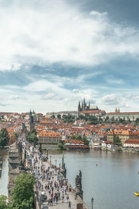 High angle view of cityscape against cloudy sky