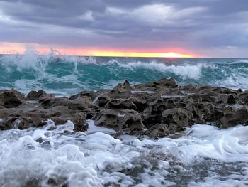 Scenic view of sea against sky during sunset