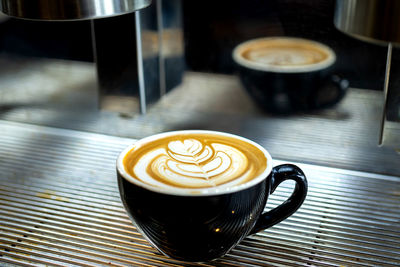 Close-up of cappuccino on table