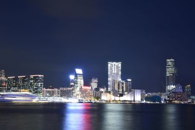 Illuminated city at waterfront