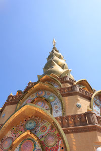 Low angle view of temple against clear blue sky