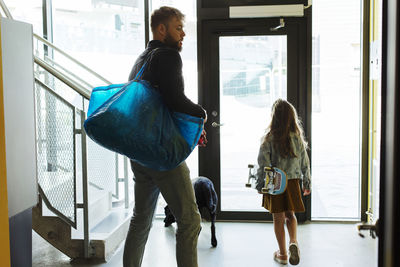 Father with daughter at staircase