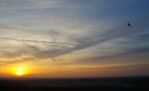 Scenic view of silhouette landscape against sky during sunset