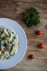High angle view of vegetables in plate on table