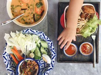 High angle view of woman preparing food on table