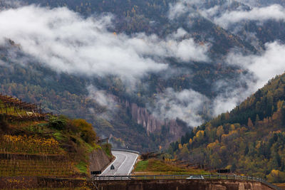 Autumn landscape in a mountain valley on the background of geological formations