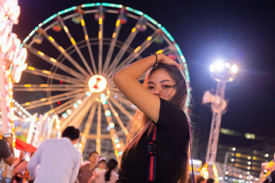 Portrait of young woman at amusement park