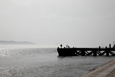 Pier on sea against sky