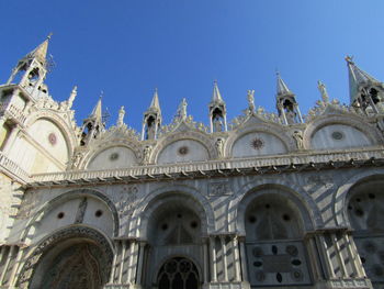 Low angle view of building against clear blue sky