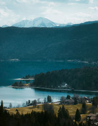 Scenic view of lake and mountains against sky