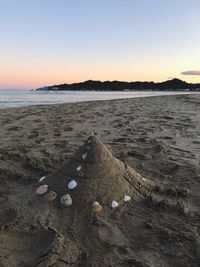 Scenic view of sea against clear sky during sunset