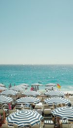 High angle view of boats in sea against clear sky