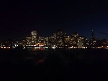 Illuminated cityscape at night