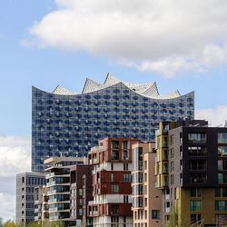 Low angle view of building against cloudy sky