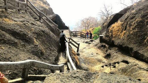 People standing on rock formation