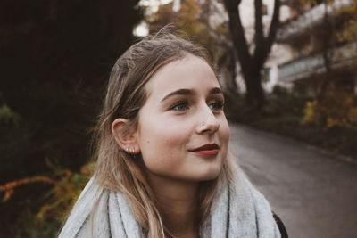 Portrait of a beautiful young woman looking away