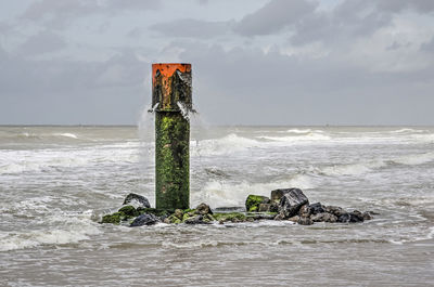 Pipe spouting water into the sea