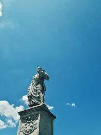 Low angle view of statue against sky