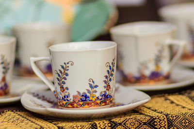 Close-up of coffee cup on table