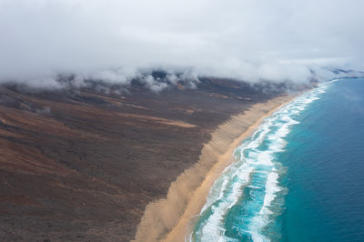 Aerial view of beach against sky