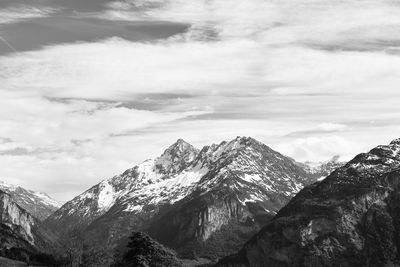 Scenic view of snowcapped mountains against sky