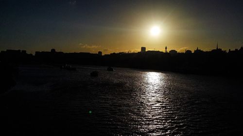 Scenic view of river at sunset