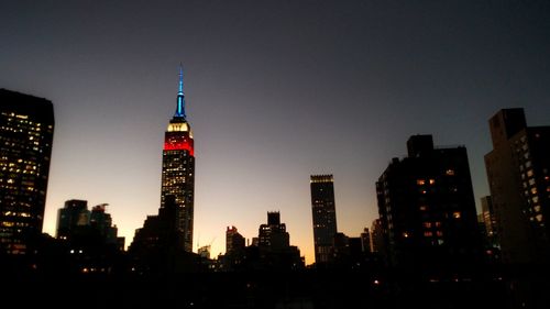 View of skyscrapers lit up at night