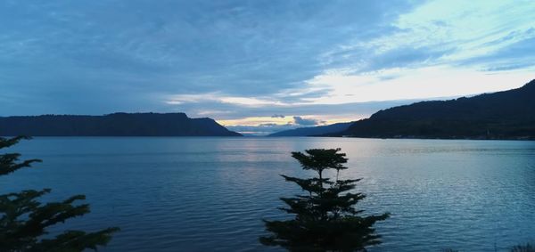 Scenic view of lake against sky during sunset