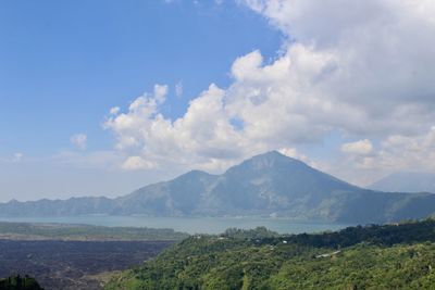 Scenic view of landscape and mountains against sky