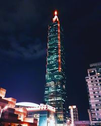 Low angle view of skyscrapers lit up at night