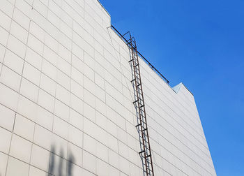 Outdoor fire escape on the wall of an office or industrial building. bottom-up view. fire escape 